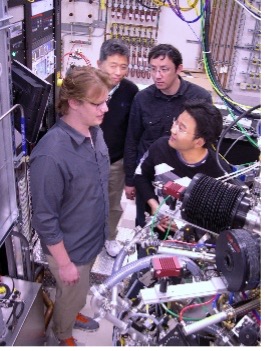 Scientists around MBE equipment